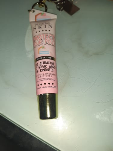 Customer's pink 'Protect Your Pout' lip conditioner tube from the Bad Bitch Energy Lip Duo attached to a keychain.