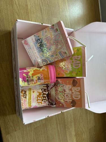 Customer's collection of colorful P.Louise Bad Bitch Energy Lip Duo products inside an open pink box.