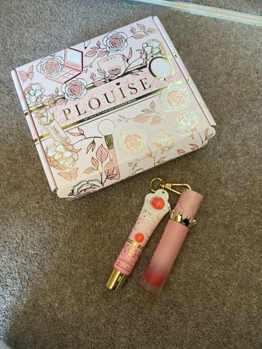 Reviewer's P.Louise Bad Bitch Energy Lip Duo, showing the lip oil and conditioner tubes next to the decorative pink box.