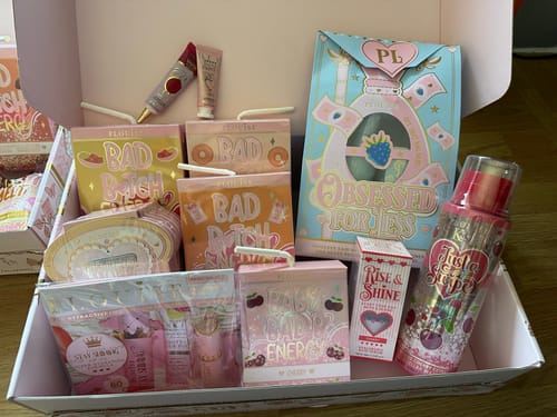 Customer's haul of P.Louise products, including several Bad Bitch Energy Lip Duos, in their colorful packaging.